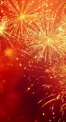 Fototapeta premium Golden fireworks explosion on a vibrant red background with glowing sparks
