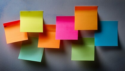Fototapeta premium colorful sticky notes arranged on gray wall