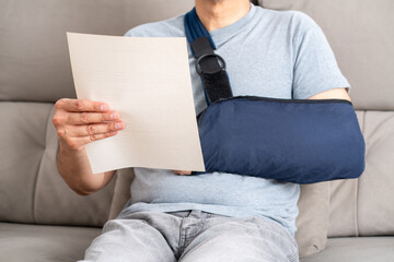Reading letter about Injury and compensation paperwork, insurance, legal contract or lawyer consulting.Disability people, attorney or advocate in negotiation,policy advice or accident report closeup