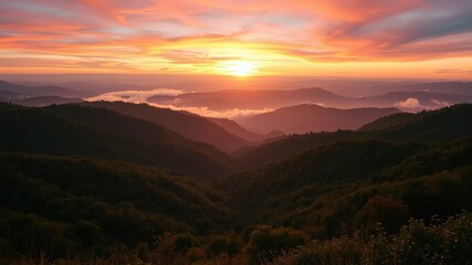 Obraz premium Serene Sunset Over Rolling Hills and Misty Valleys