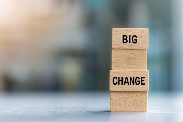 Wooden Blocks Representing Big Change on a Blurred Background in Soft Light