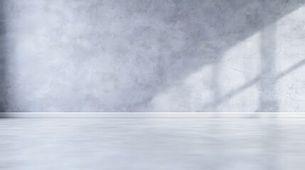 Minimalist Grey Room with Smooth Walls and Floor Evoking Calm and Sophisticated Aesthetic