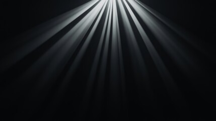 Obraz premium Bright light rays emanating from above, dark background.