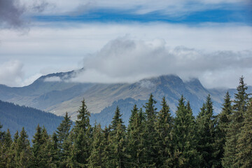 Majestic mountain landscape in Salzburg, Austria with clouds hovering over the peaks
