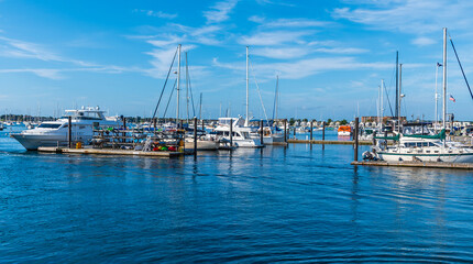 Fototapeta premium A view from the harbor of boats moored off Newport, USA in the fall