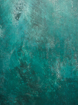 A vivid turquoise surface fills the space with a sense of depth and texture, resembling an abstract painting that evokes calm and creativity in a contemporary setting