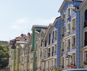 Multicolor modern Facade of Houses Buildings. Bright windows architecture street