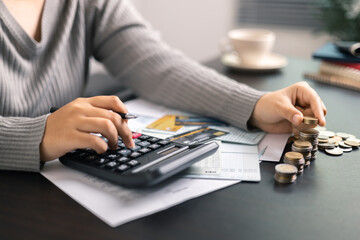 Finance bank tax expense accounting budget money businessman hand use calculator Financial...