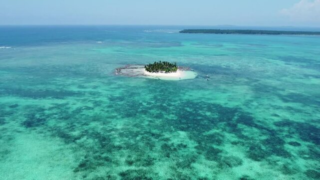 Aerial footage of the Guyam Island on a sunny day in General Luna, Surigao del Norte, Philippines