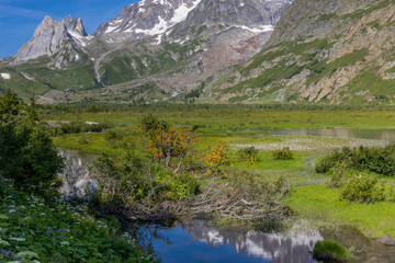 Val Veny mountain landscape in Courmayeur, italian Alps on Tour du Mont Blanc hiking route TMB. Trekking and hiking in the Alps among beautiful landscape and stunning scenery of the Alps green valleys