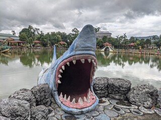 The shark statue at the edge of the pool