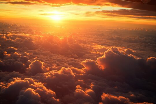 Golden sunset over clouds from airplane window capturing serenity and majesty