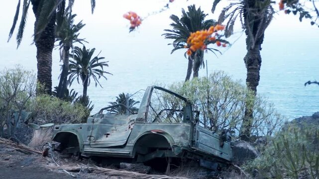 abandoned car on the scenic coastal trail along La Gomera's rugged northern coastline near Agulo, showcasing the island's wild beauty.