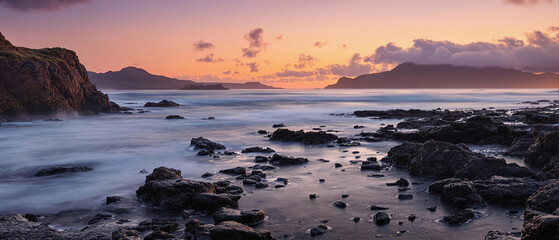 Fototapeta premium epic sunset sunrise at the coast beach waves mist fog dreamy Greenland or Iceland