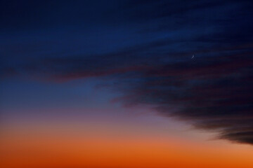 Dark purple sky at sunset. Saturated yellow sky. Lilac clouds. Universal photo. Feeling.