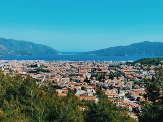 Fototapeta premium A tranquil Turkish seaside village, sheltered by majestic mountains.