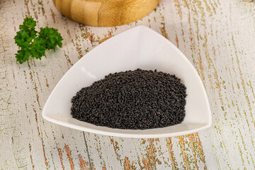 Black dry Nigella seeds in the bowl