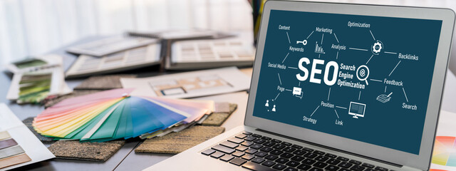 Interior designer workspace table and architecture software on laptop screen with mood board materials and colorful swatch color for color selection. Modern interior design office. Insight