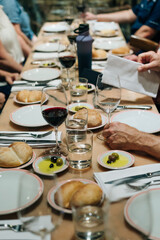 tableware Glasses, flower fork, knife served for dinner in restaurant with cozy interior