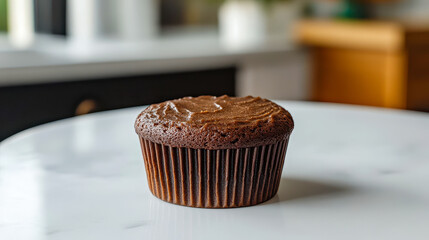 Delightful cupcake adorned with colorful sprinkles and fluffy pink frosting in a cozy kitchen setting