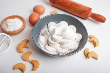 kue putri salju or princess snow cookies or snow white cookies isolated on white. popular indonesian cookies for lebaran. selected focus