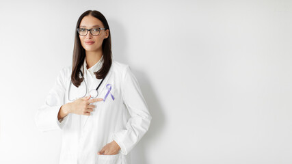 Woman doctor pointing at violet purple ribbon awareness symbol for Pancreatic cancer, Hodgkin's lymphoma, epilepsy and Testicular Cancer, panorama, free space
