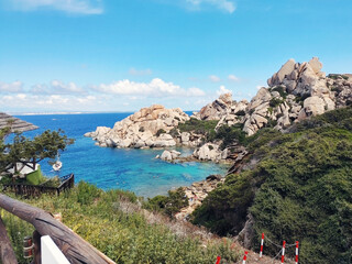 Obraz premium Stunning cove Cala Spinosa with granite rocks sculpted by erosion and a small hidden beach. Capo Testa in Santa Teresa Gallura, Sassari, Sardinia Island, (Sardegna), Italy.