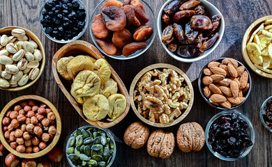 Composition with a variety of dried fruits and assorted nuts.