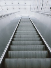 A long elevator in Dongguan, Guangdong, China, Asia, with a bright light at the end. Top view