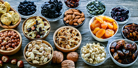 Composition with a variety of dried fruits and assorted nuts.