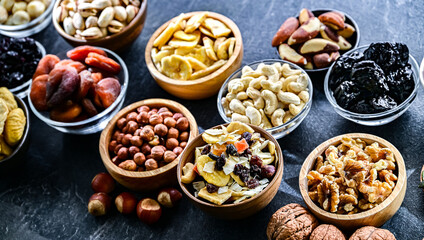 Composition with a variety of dried fruits and assorted nuts.