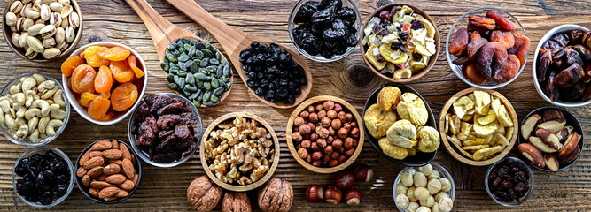 Composition with a variety of dried fruits and assorted nuts.