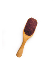 ground coffee in wooden spoon isolated on white background. top view.