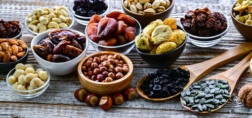 Composition with a variety of dried fruits and assorted nuts.