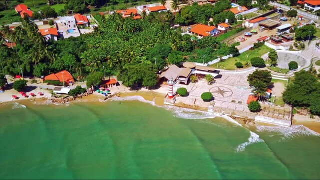 With crystal-clear waters, steady winds, and its iconic lighthouse, Paracuru, Ceara, is a prime destination for kitesurfing and relaxation in nature.