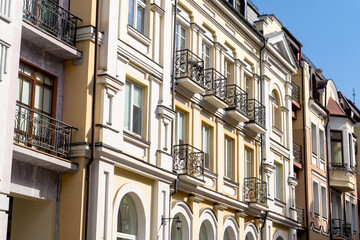 Obraz premium Modern exterior of houses buildings. Balcony windows facade. Bright architecture street