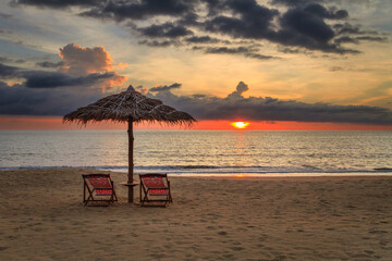 Sunbeds on a beach in Thailand at sunset