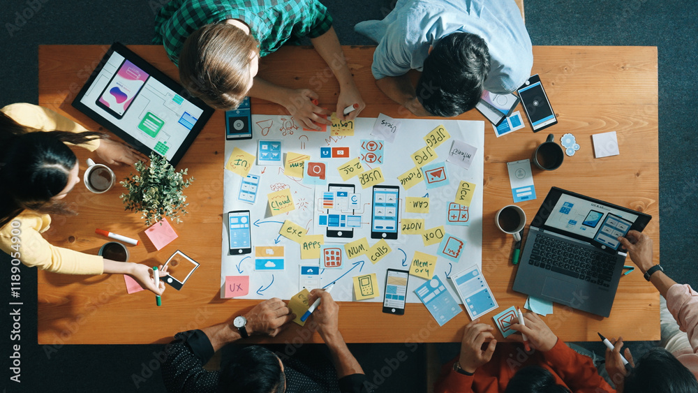  top view of developer team sharing idea of ux ui design by using mind map. top down view of group of