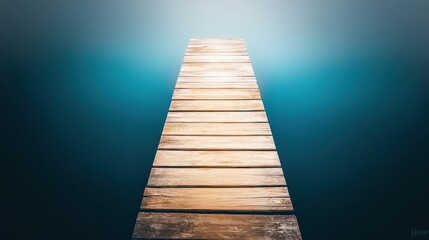 Fototapeta premium Wooden dock extending into a misty, teal lake.
