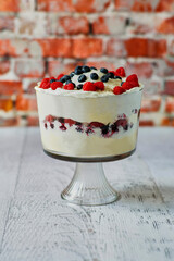 layered berry trifle with sponge cake and whipped cream