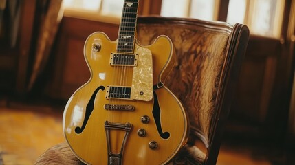 Naklejka premium Vintage hollow-body electric guitar resting on an antique chair in a sunlit room.