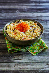 simple coleslaw served in a dark bowl
