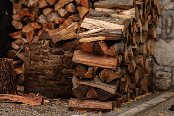 Sharp and blurred view pile of chopped firewood. Logs for the fire