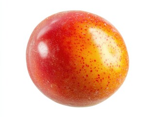 Obraz premium close-up of a round, red and yellow fruit with small red dots on a white background.
