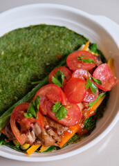 Healthy breakfast, spinach egg wrap.