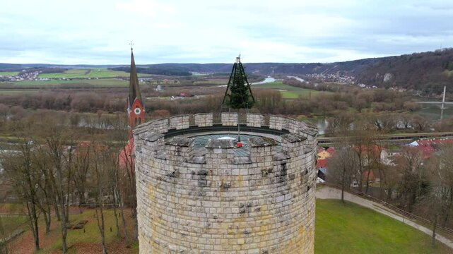 Aerial view of Heinrichsturm in Bad Abbach, Bavaria, Germany. This medieval tower surrounded by scenic Bavarian hills, Danube River and countryside, offers breathtaking views and historical heritage. 