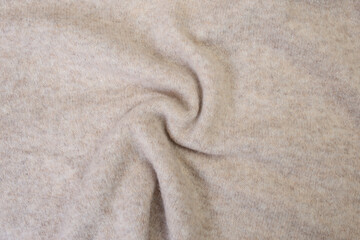 Soft beige fabric spiral , abstract backdrop for product placement