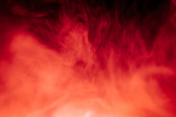Abstract red and black smoky texture resembling fire or fog, with dramatic swirling patterns creating a sense of heat, mystery, and intensity.