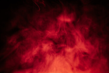 Abstract red and black smoky texture resembling fire or fog, with dramatic swirling patterns...