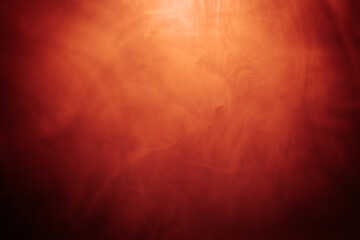 Abstract red and black smoky texture resembling fire or fog, with dramatic swirling patterns creating a sense of heat, mystery, and intensity.